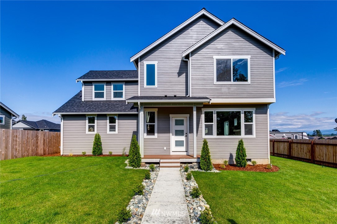 5572 South Church Road Ferndale, WA 98248 - Photo 1 of 30 a front view of a house with a yard and garage