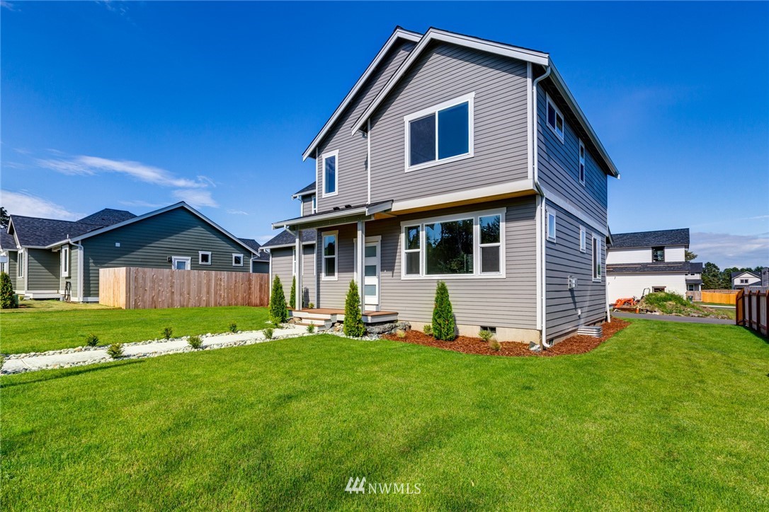 5572 South Church Road Ferndale, WA 98248 - Photo 2 of 30 a front view of a house with a yard and trees