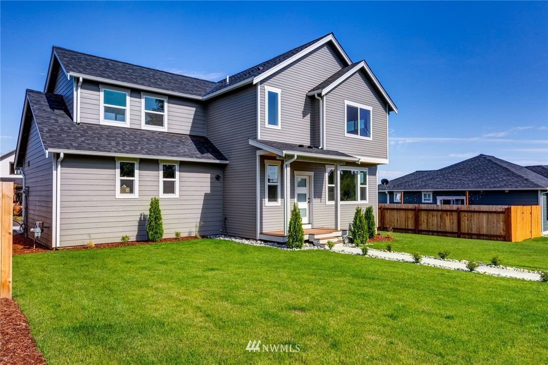 5572 South Church Road Ferndale, WA 98248 - Photo 25 of 30 a front view of a house with a yard and garage