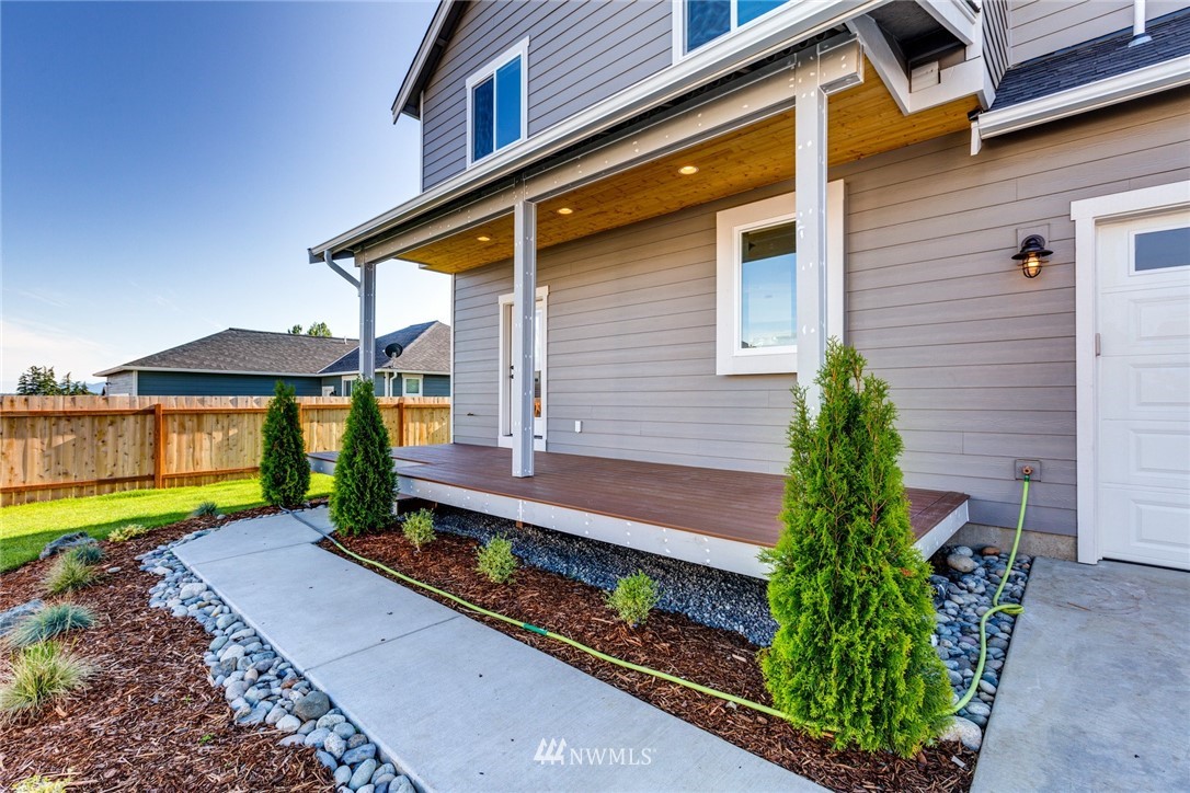 5572 South Church Road Ferndale, WA 98248 - Photo 29 of 30 a front view of a house with a yard and outdoor seating