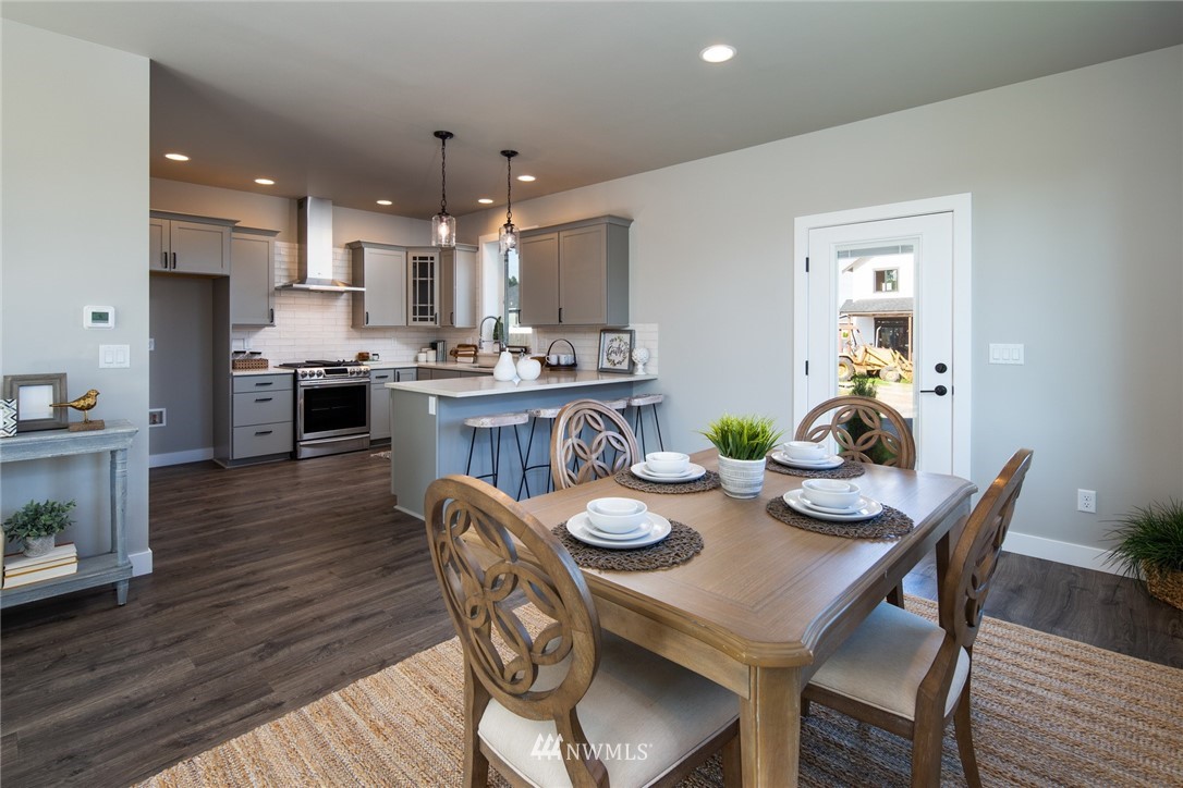 5572 South Church Road Ferndale, WA 98248 - Photo 10 of 30 a view of a dining room with furniture and wooden floor