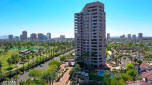 a living room with furniture and floor to ceiling window