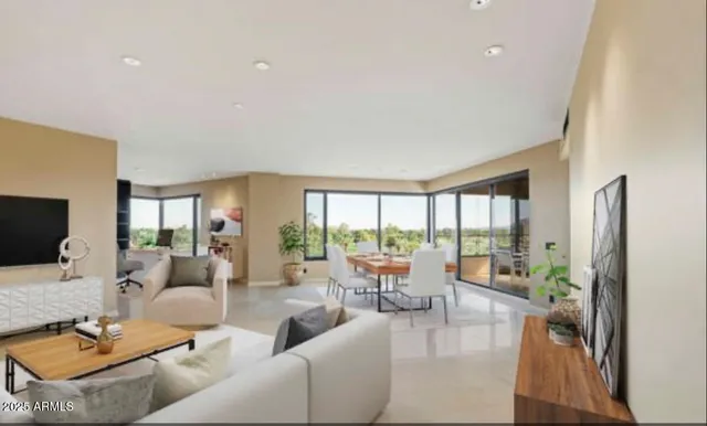 a spacious bedroom with a large bed and a couch