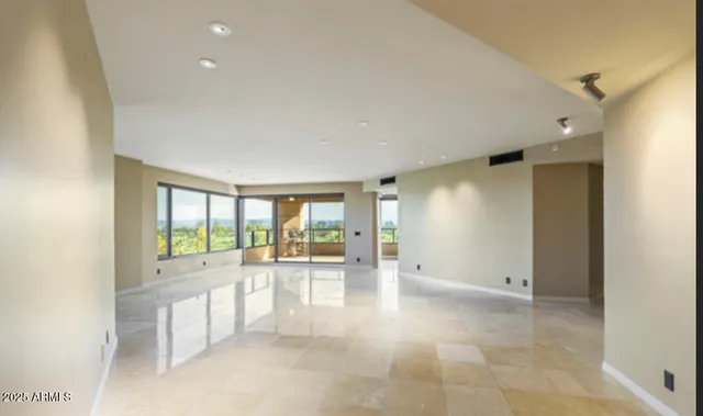 a view of a swimming pool with a patio and a yard