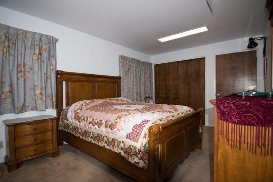 6681 Domino Road Central Point, OR 97502 - Photo 14 of 17 a bedroom with a bed and a dresser