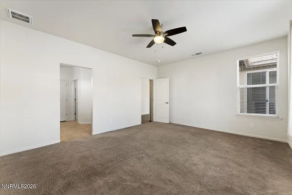 a kitchen with stainless steel appliances granite countertop a sink refrigerator and microwave