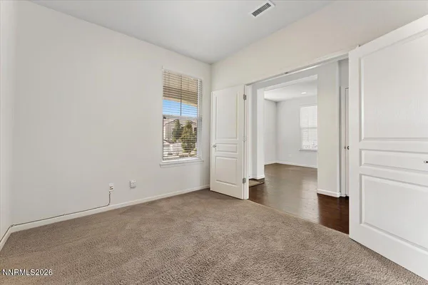a bedroom with a large bed and a couch