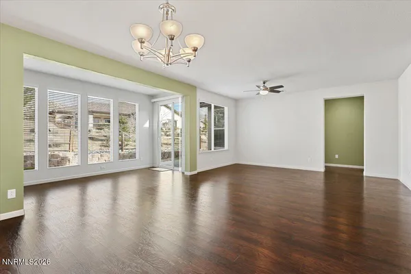 a view of kitchen and hall with wooden floor