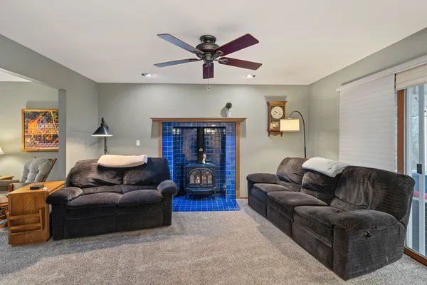 a living room with furniture and a fireplace