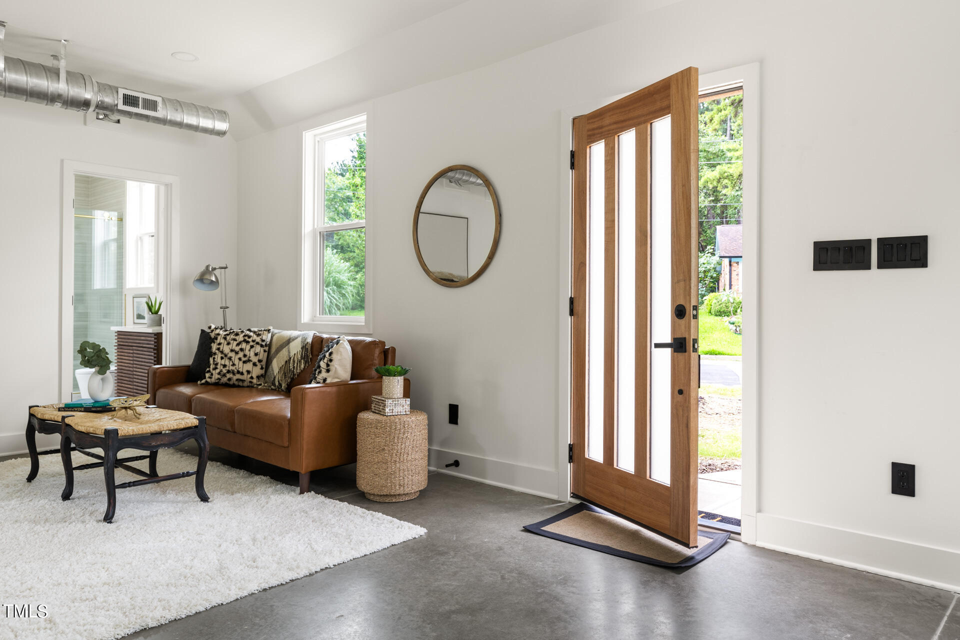 2909 Herring Boulevard Durham, NC 27704 - Photo 11 of 47 a living room with furniture and a large window