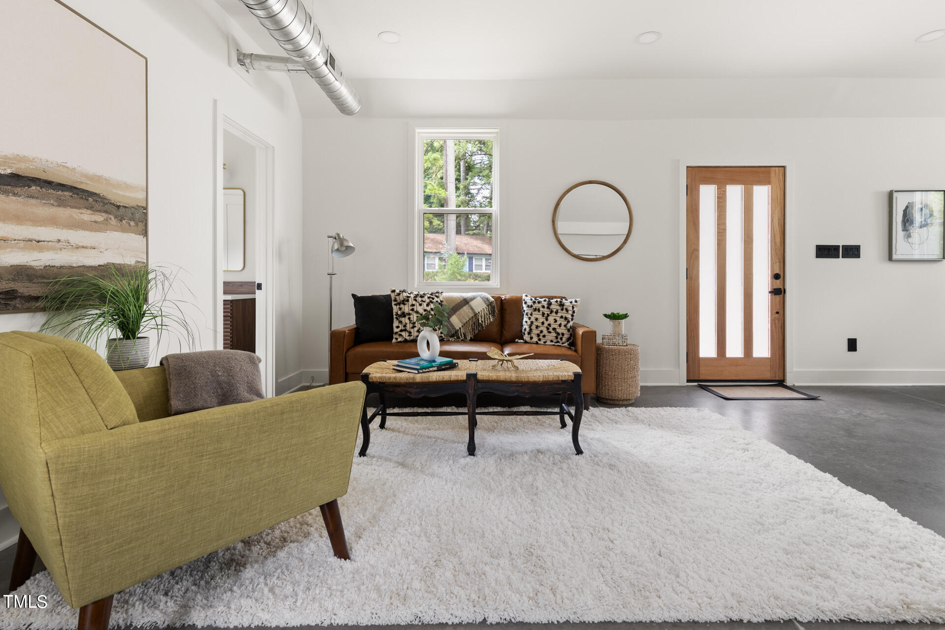 2909 Herring Boulevard Durham, NC 27704 - Photo 17 of 47 a living room with furniture wooden floor and a window