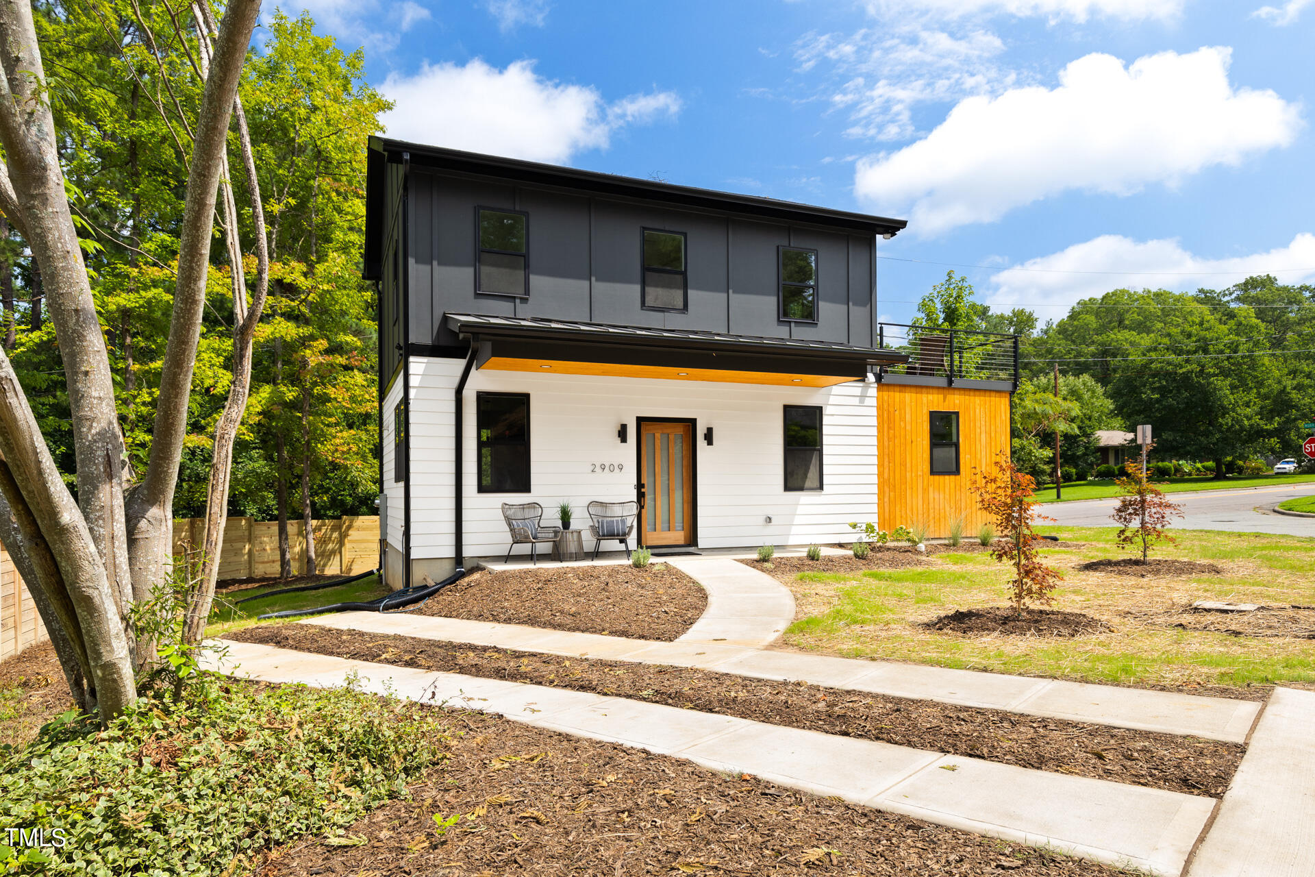2909 Herring Boulevard Durham, NC 27704 - Photo 2 of 47 a view of a house with entertaining space and a ocean view in the background