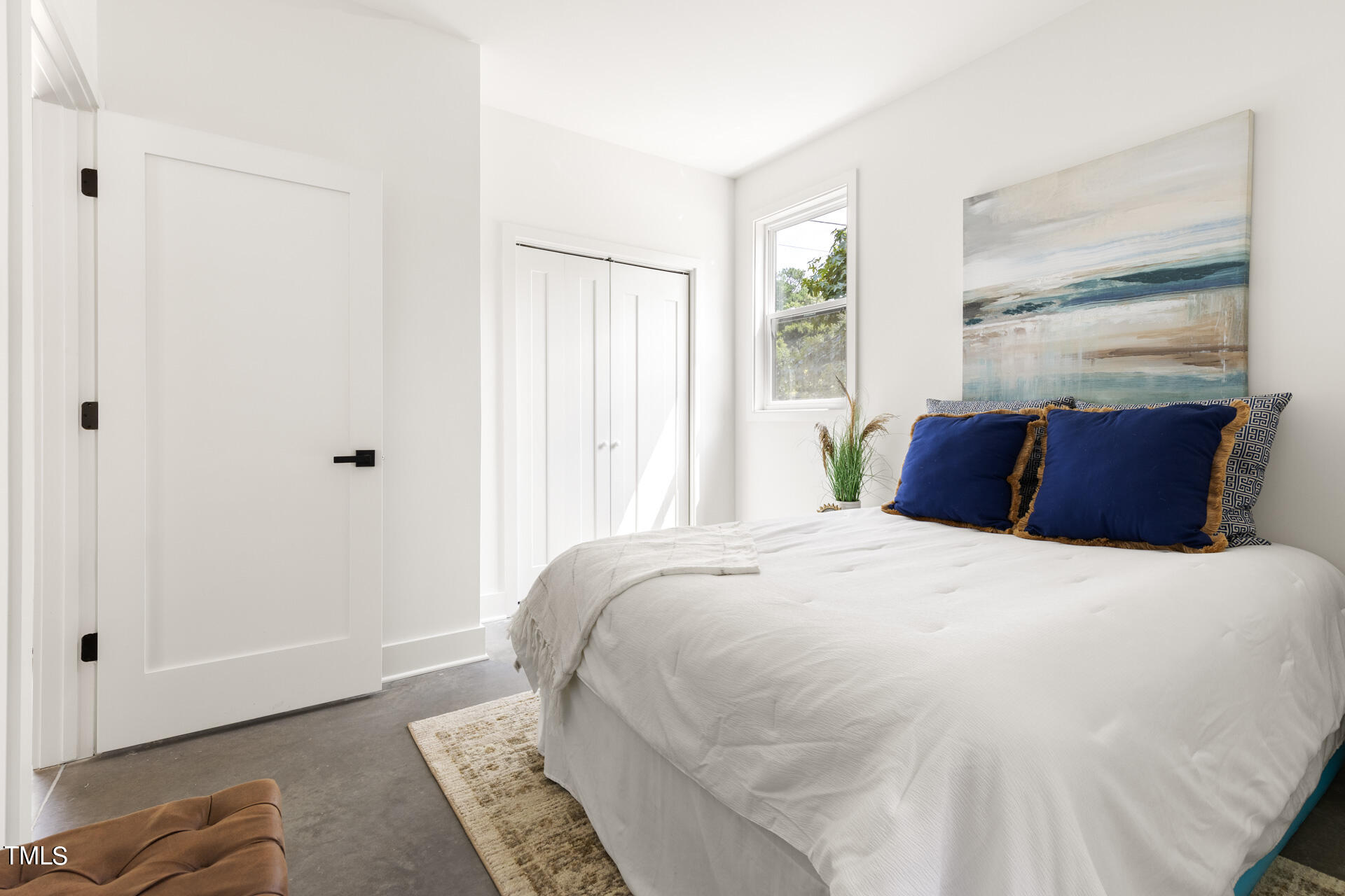 2909 Herring Boulevard Durham, NC 27704 - Photo 22 of 47 a bedroom with a bed and wooden floor