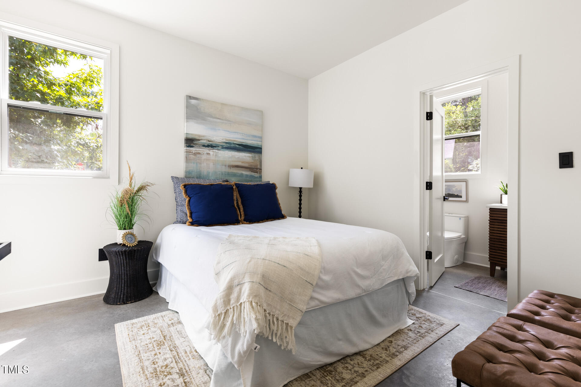 2909 Herring Boulevard Durham, NC 27704 - Photo 24 of 47 a bedroom with a bed and wooden floor