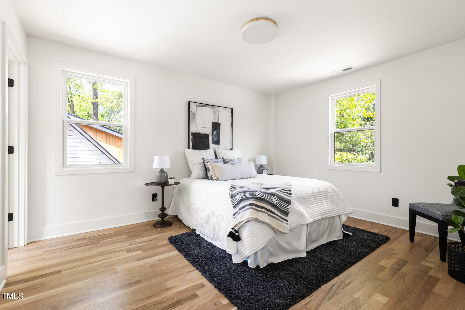 2909 Herring Boulevard Durham, NC 27704 - Photo 30 of 47 a bedroom with a bed and a window