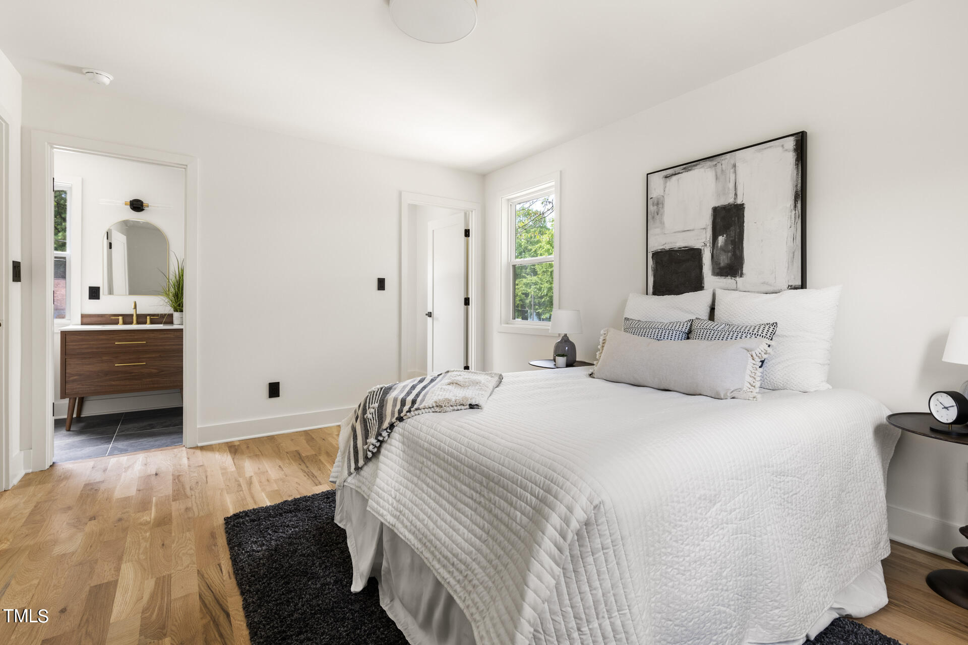 2909 Herring Boulevard Durham, NC 27704 - Photo 33 of 47 a bedroom with a bed and a view of bathroom