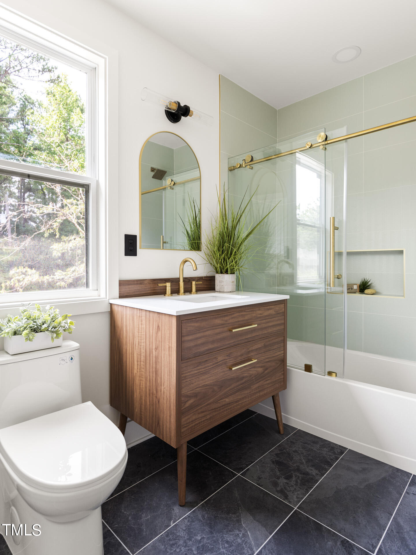 2909 Herring Boulevard Durham, NC 27704 - Photo 35 of 47 a bathroom with a sink toilet and shower