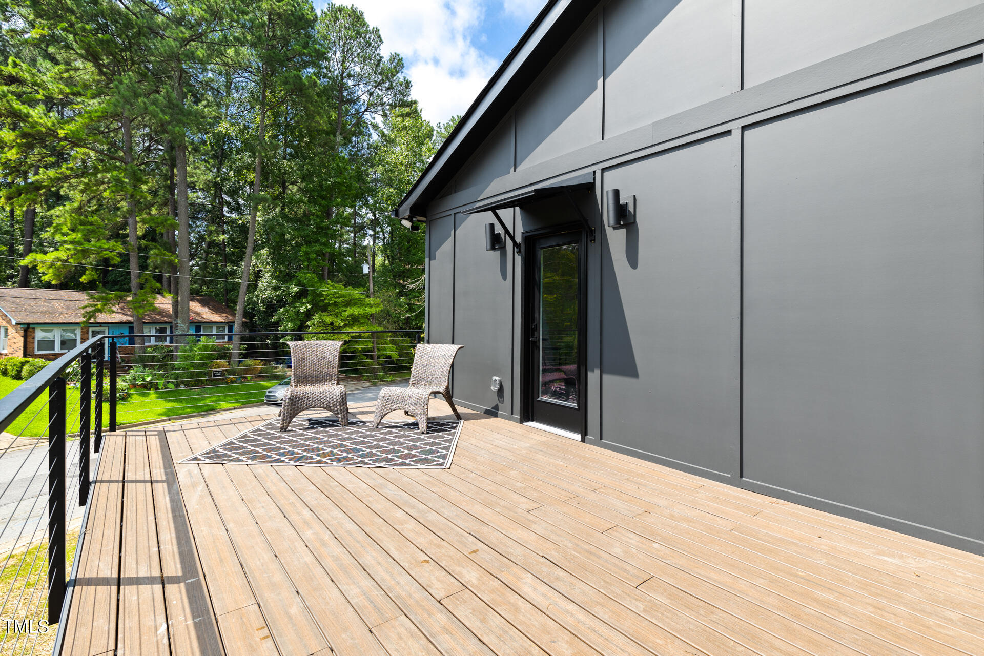 2909 Herring Boulevard Durham, NC 27704 - Photo 40 of 47 a view of a deck with chairs and wooden floor