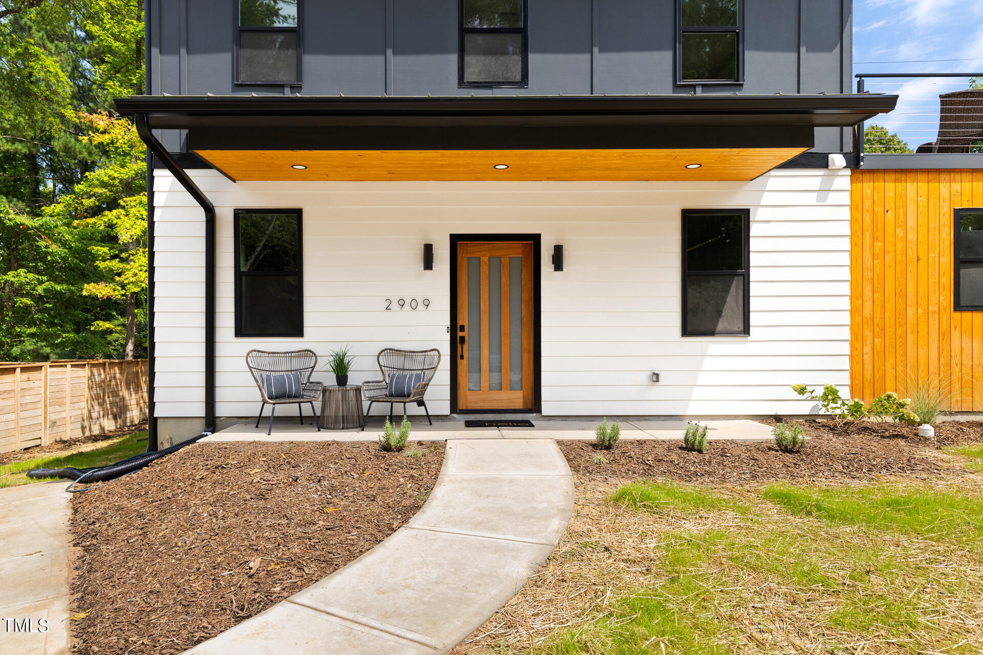 2909 Herring Boulevard Durham, NC 27704 - Photo 4 of 47 a backyard of a house with yard and outdoor seating