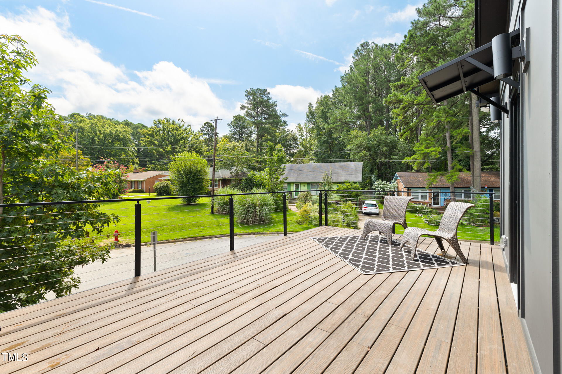 2909 Herring Boulevard Durham, NC 27704 - Photo 42 of 47 a view of a deck with table and chairs with wooden floor and fence