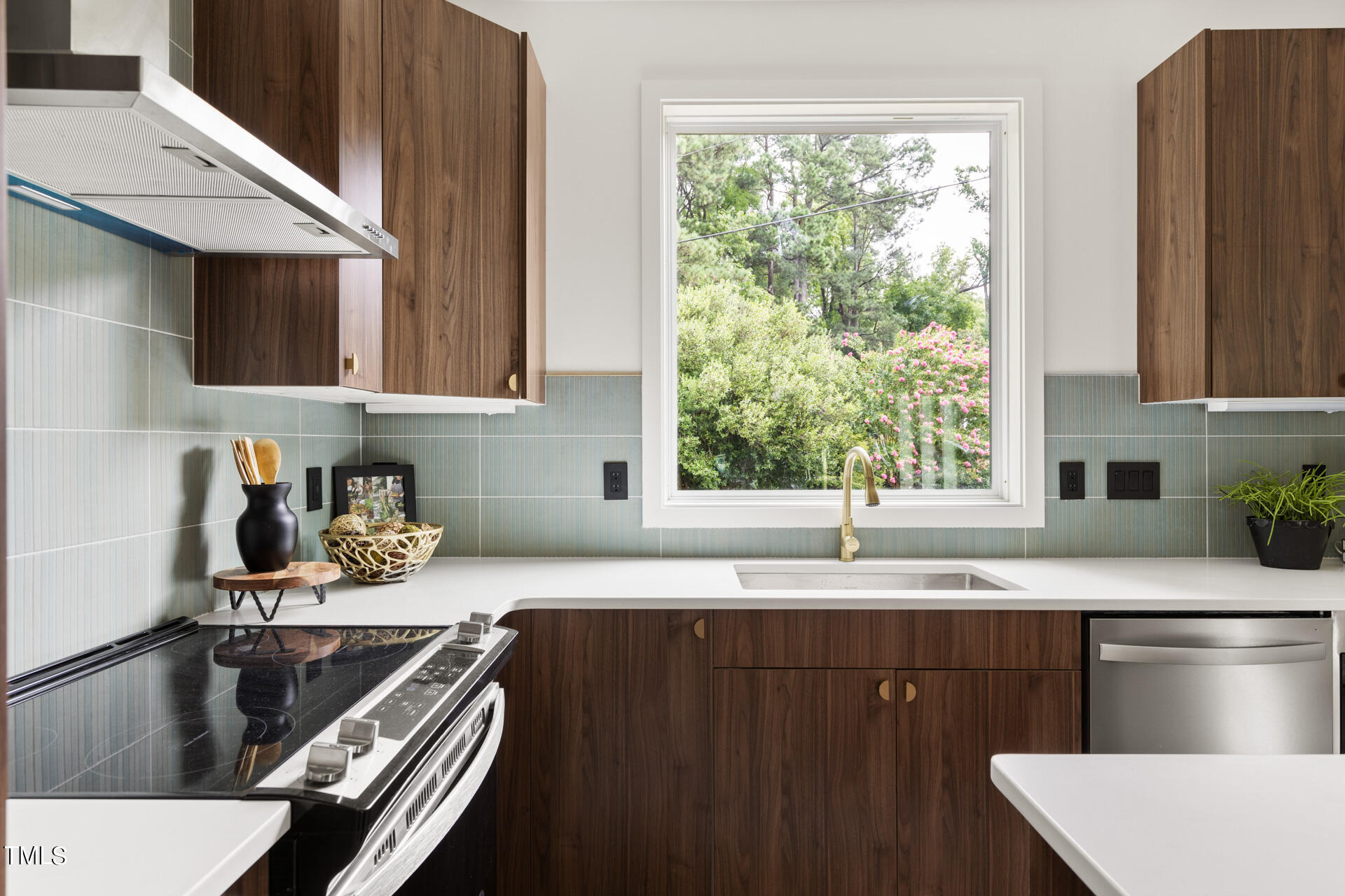 2909 Herring Boulevard Durham, NC 27704 - Photo 5 of 47 a kitchen with granite countertop a sink stove and cabinets