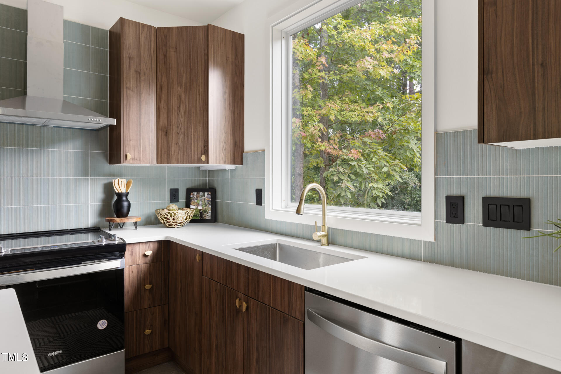 2909 Herring Boulevard Durham, NC 27704 - Photo 7 of 47 a kitchen with stainless steel appliances a sink a stove and a microwave