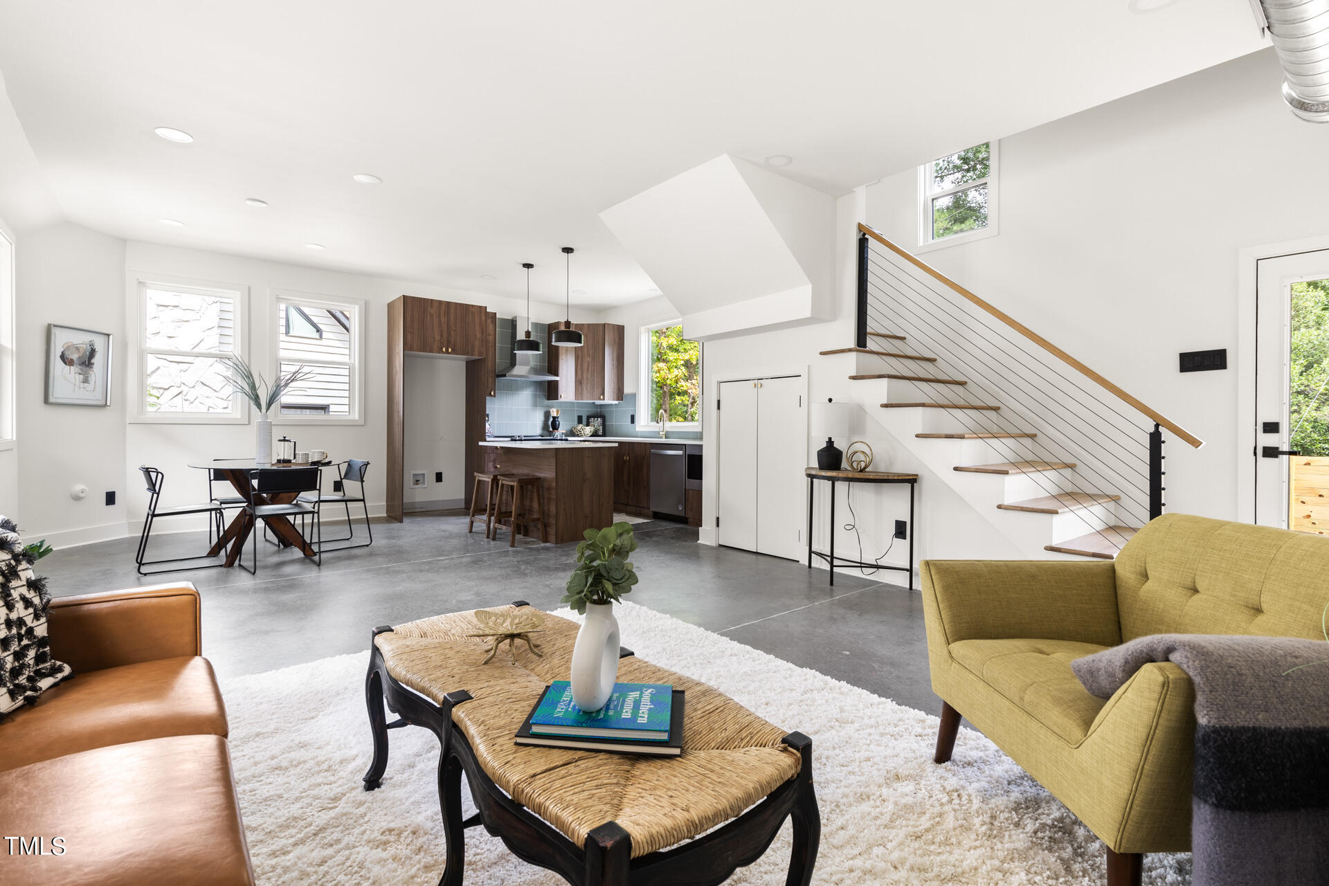 2909 Herring Boulevard Durham, NC 27704 - Photo 10 of 47 a living room with furniture kitchen view and a wooden floor