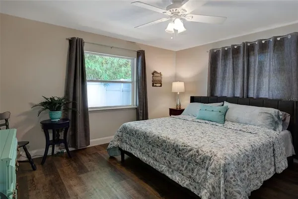 a kitchen with a granite countertop sink stove and cabinets
