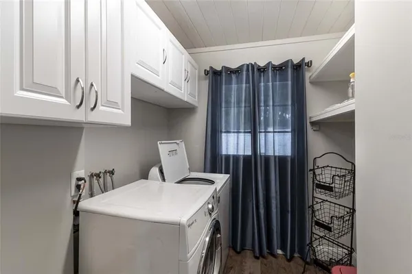 a kitchen with a refrigerator stove top oven and sink