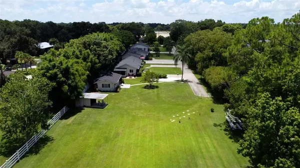 an aerial view of a house with a lake view