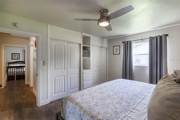 a bedroom with bed and a window