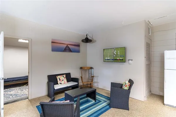 a view of a two chairs in a backyard