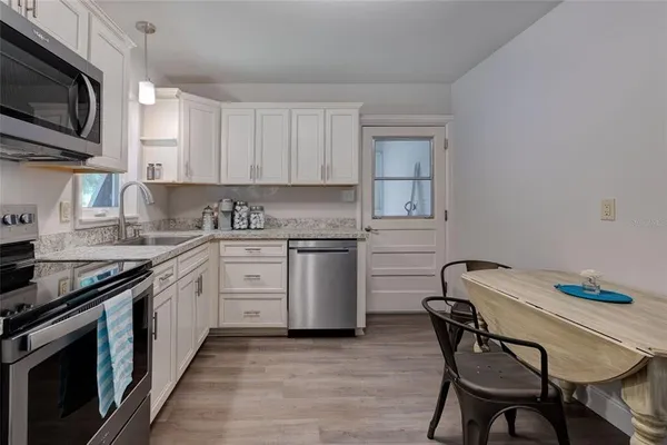 a view of a livingroom with furniture and a window