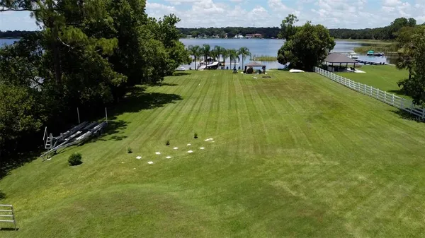 a kitchen with stainless steel appliances granite countertop a sink and dishwasher a stove top oven with wooden floor