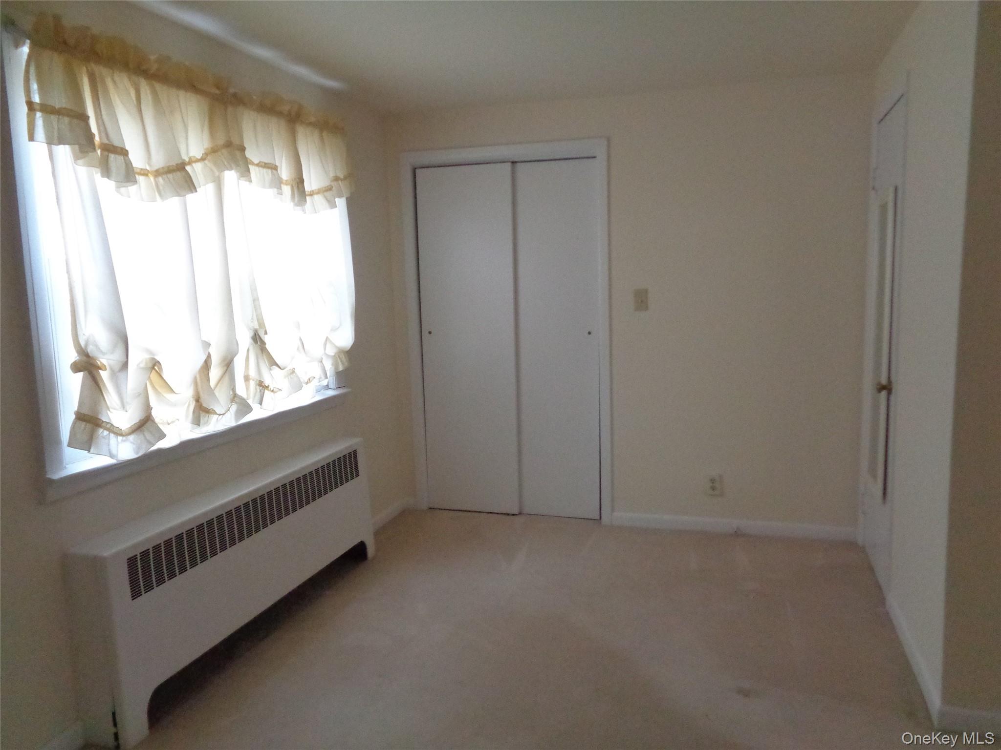9 Valley Terrace Port Chester, NY 10573 - Photo 13 of 25 a view of an empty room and window
