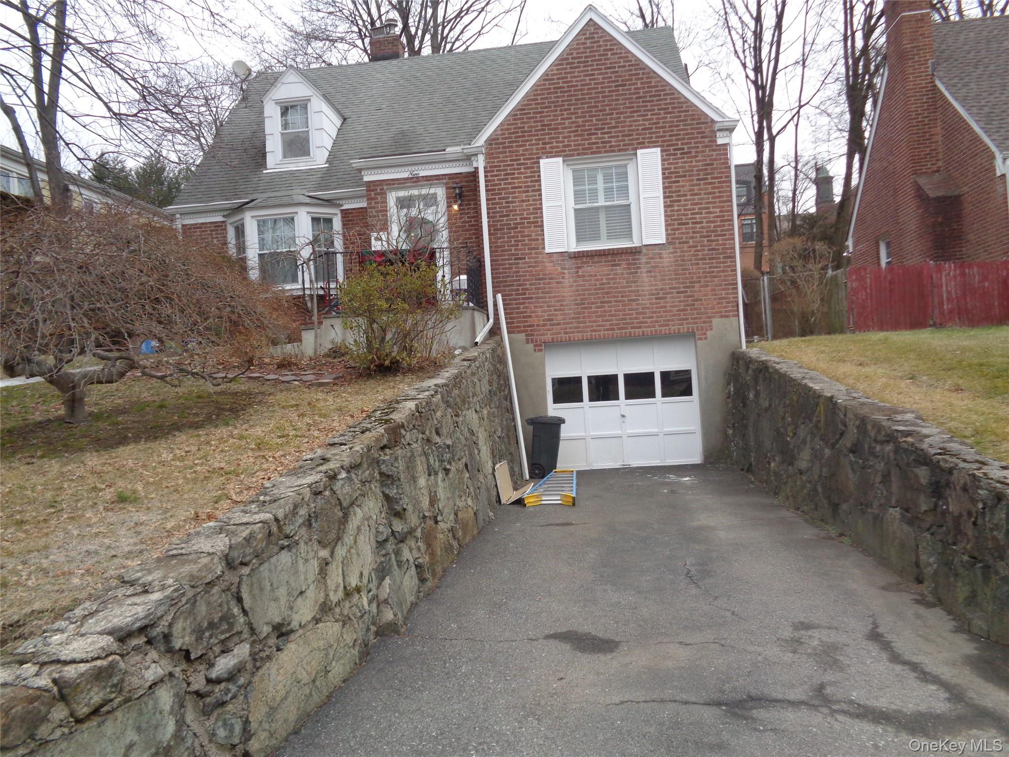 9 Valley Terrace Port Chester, NY 10573 - Photo 19 of 25 a front view of a house with a yard