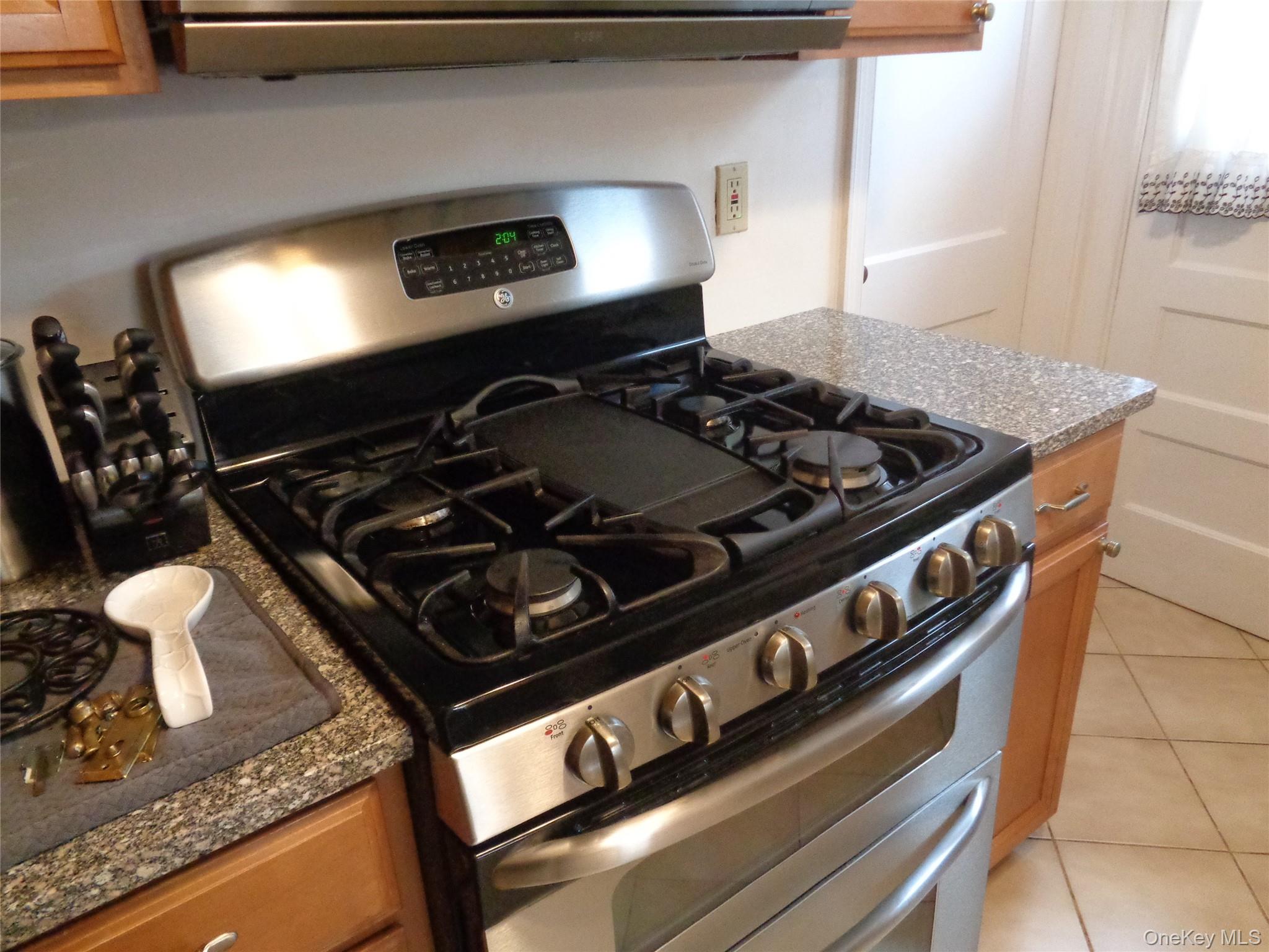 9 Valley Terrace Port Chester, NY 10573 - Photo 20 of 25 a stove top oven sitting inside of a kitchen