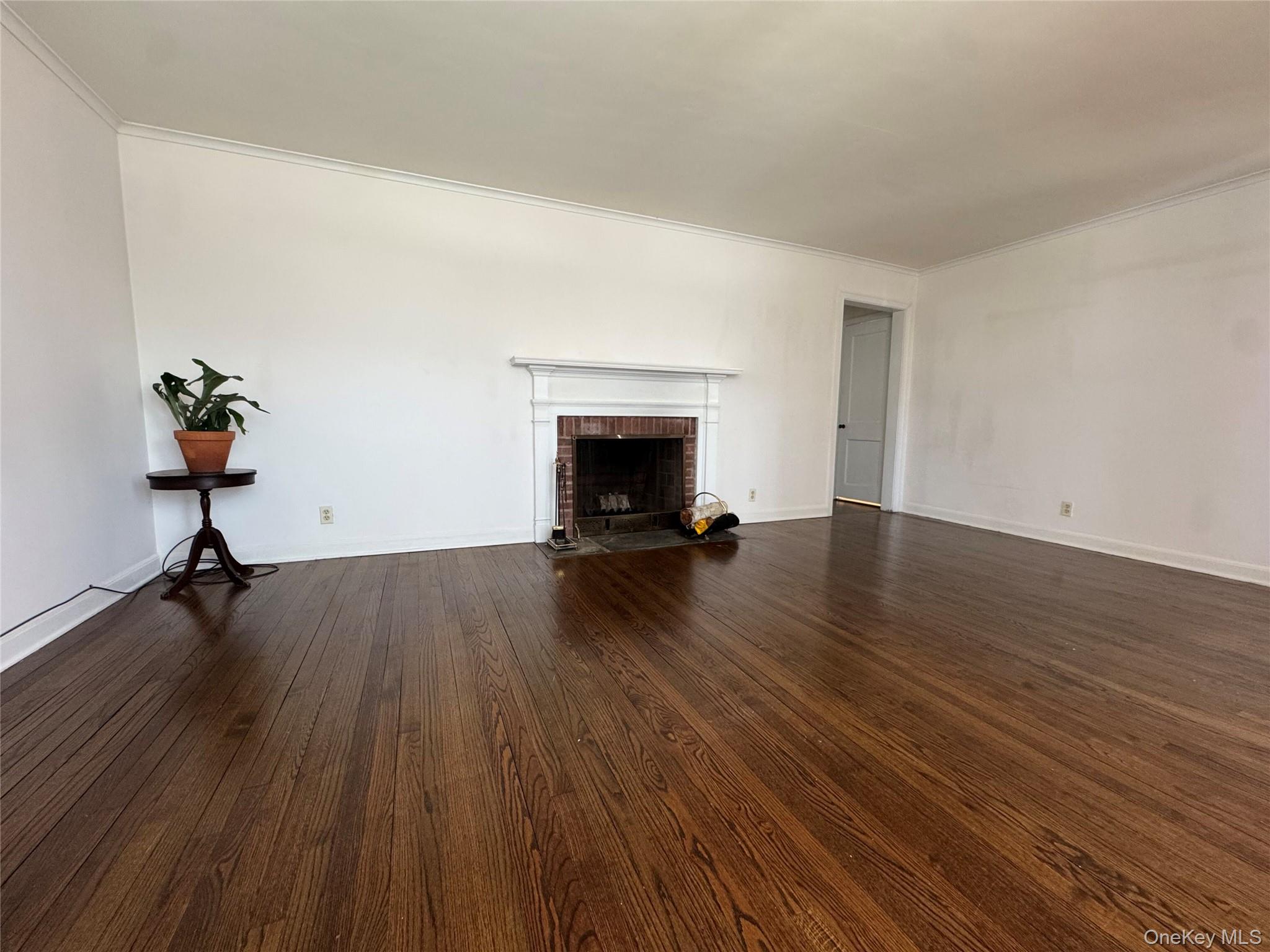 9 Valley Terrace Port Chester, NY 10573 - Photo 24 of 25 a view of a livingroom with wooden floor and a fireplace