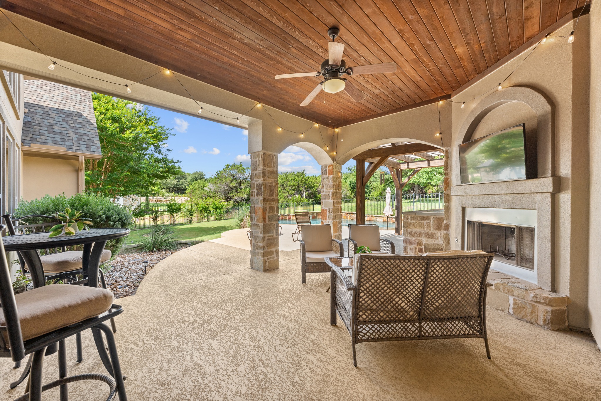 1301 Lions Lair Leander, TX 78641 - Photo 36 of 40 Covered outdoor living area with fireplace