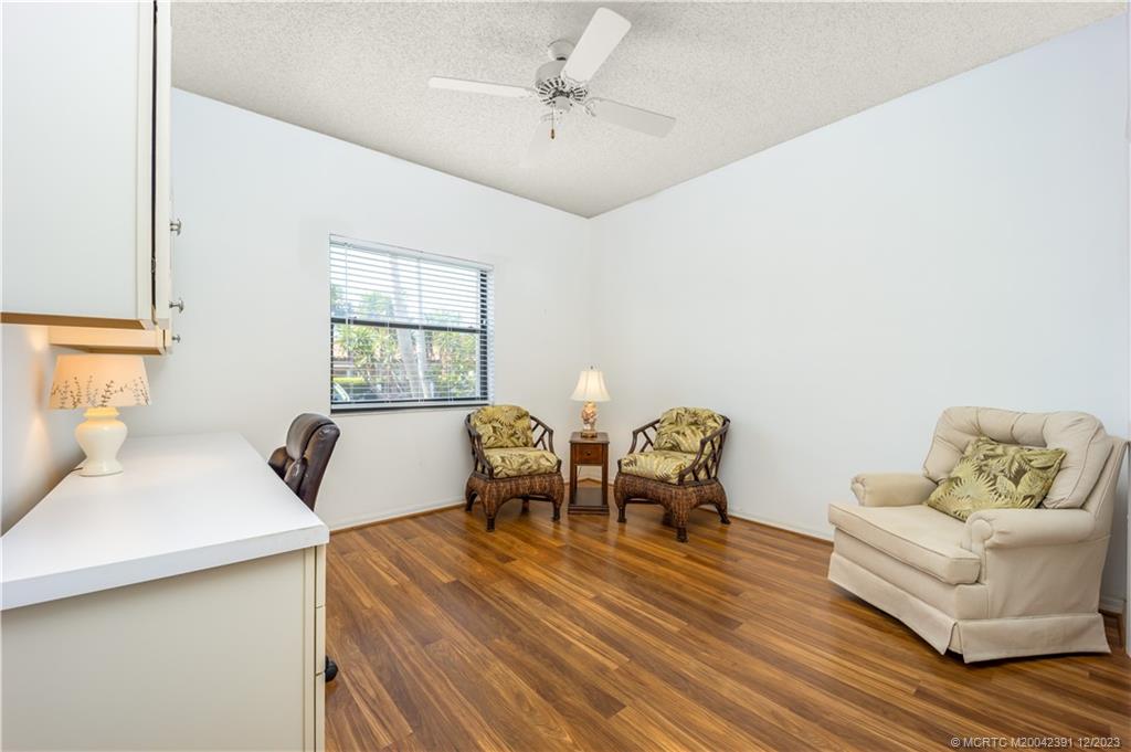 6101 Southeast Landing Way, Unit 5 Stuart, FL 34997 - Photo 10 of 13 a bedroom with furniture and windows