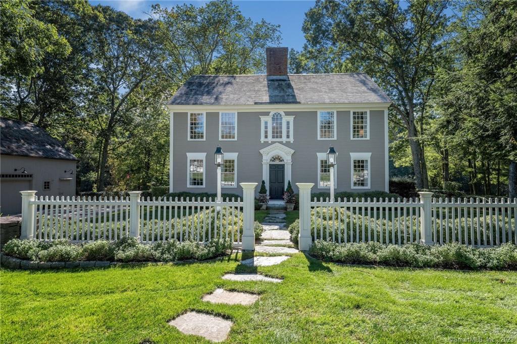 2 Stone Post Road Lyme, CT 06371 - Photo 1 of 1 a front view of a house with a garden and yard