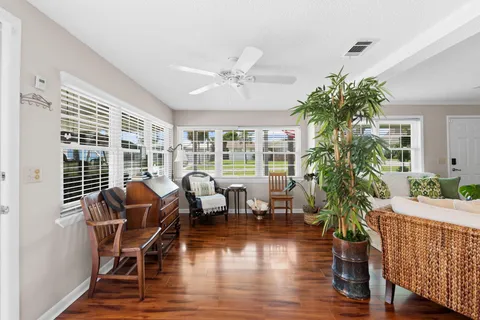 a living room with furniture and a window