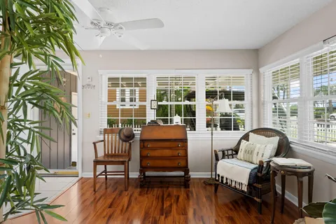 a living room with furniture and kitchen view