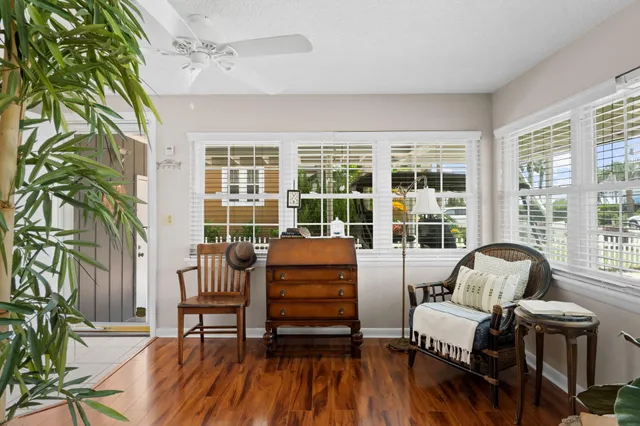 a living room with furniture and kitchen view