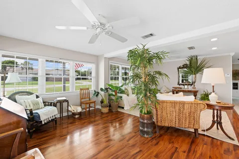 a kitchen with granite countertop cabinets and chairs