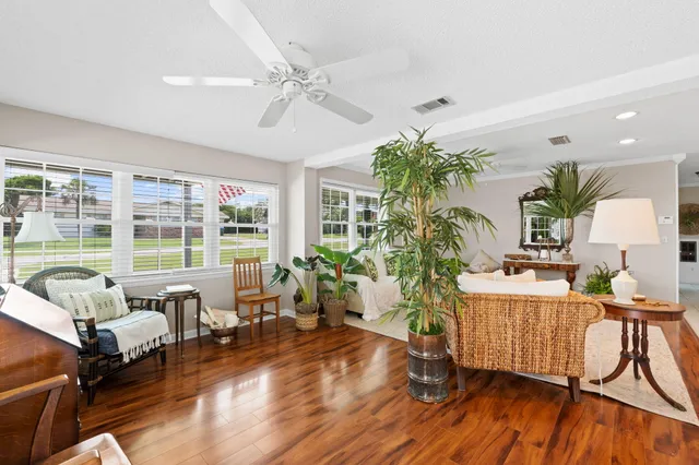 a kitchen with granite countertop cabinets and chairs