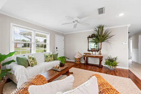 a kitchen with stainless steel appliances a stove a sink a microwave a refrigerator and cabinets