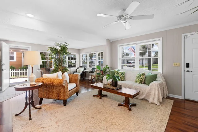 a large kitchen with kitchen island a large counter top stainless steel appliances and cabinets