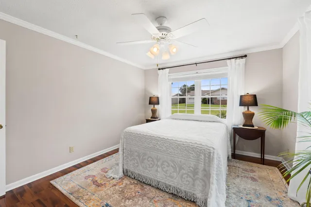 a bedroom with a bed and dresser