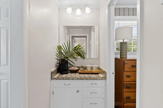 a view of a balcony with wooden floor and fence